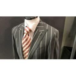 Grijs colbert van SUITSUPPLY. Maat 44. Slimfit