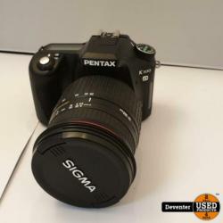 Pentax K100D met Sigma 28-300 mm DL Hyperzoom lens en tas