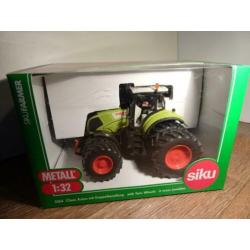 Te koop Siku Claas 840 Axion dubbellucht.