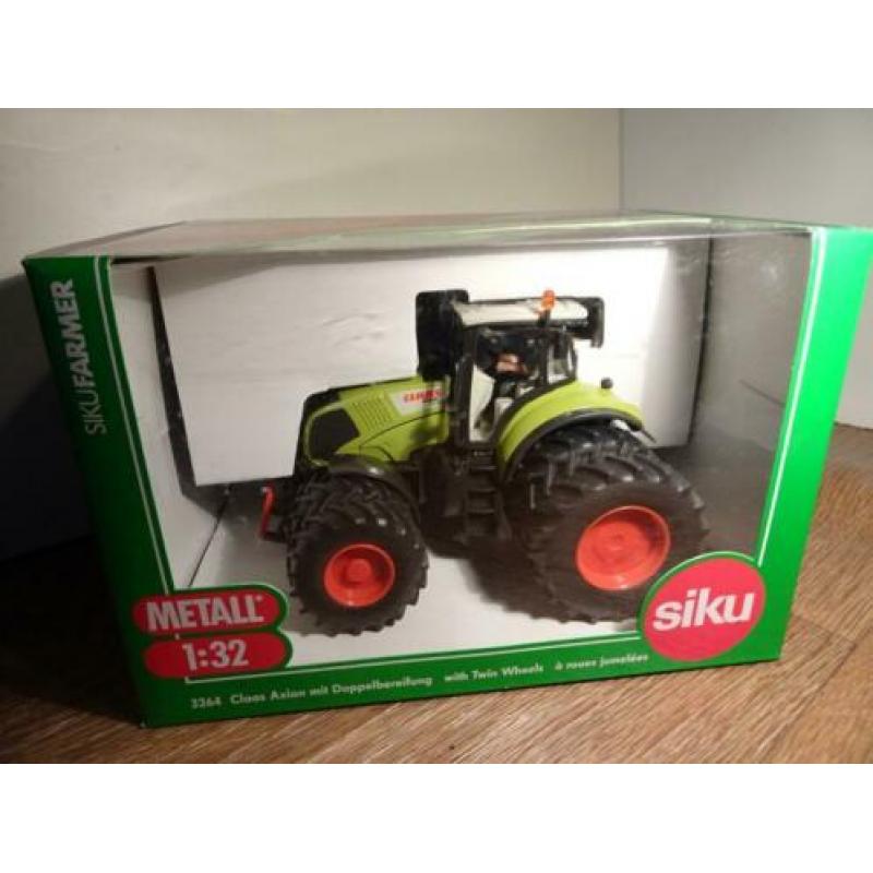 Te koop Siku Claas 840 Axion dubbellucht.