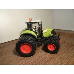 Te koop Siku Claas 840 Axion dubbellucht.