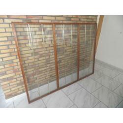 merbau raamwerk met glas in koper